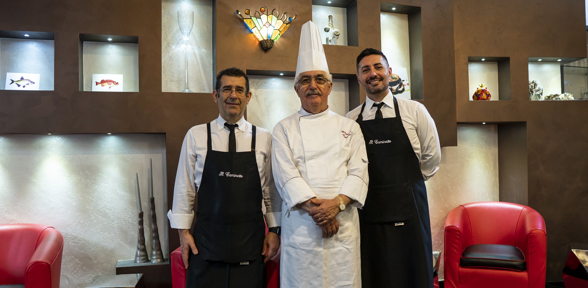 Lo chef Nazareno Fontana con due uomini di sala del Ristorante Il Caminetto di Terracina